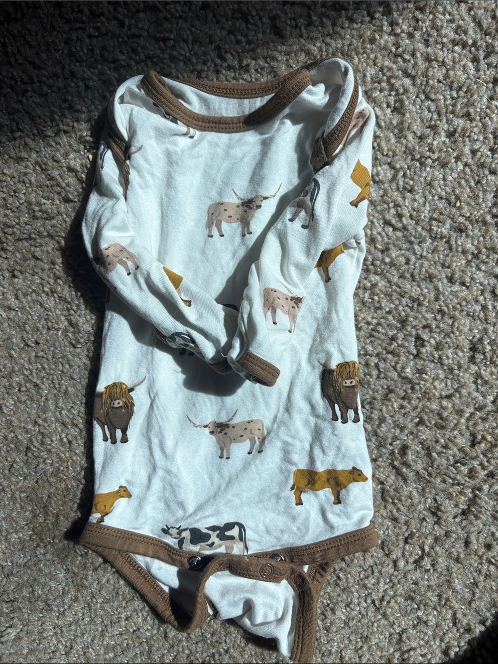 Kyte 0-3 mo One-Piece Bodysuit in White with Brown Trim and cow Print